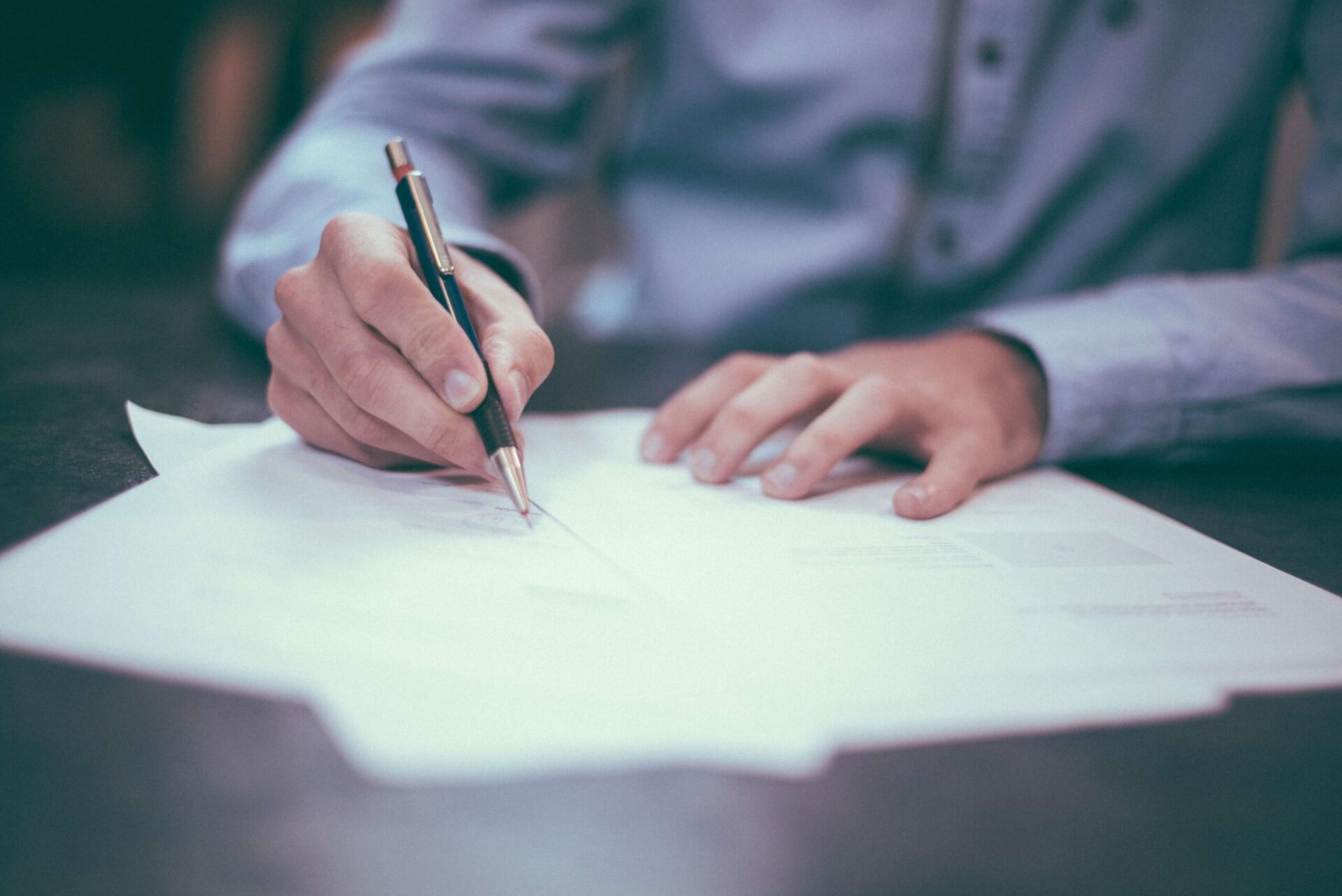Legal Aspects of Divorce (1) Image depicting a divorce coach working at a desk with client in Boulder